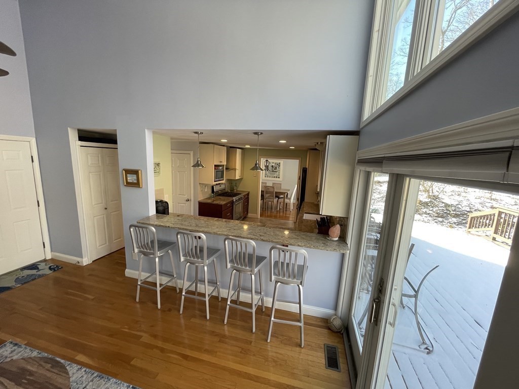 32 Birch Way Mashpee, MA 02649 - Photo 11 of 31 a view of a dining room with furniture window and wooden floor