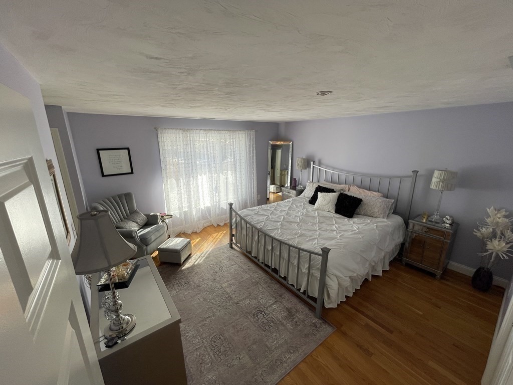 32 Birch Way Mashpee, MA 02649 - Photo 16 of 31 a bedroom with a bed and window