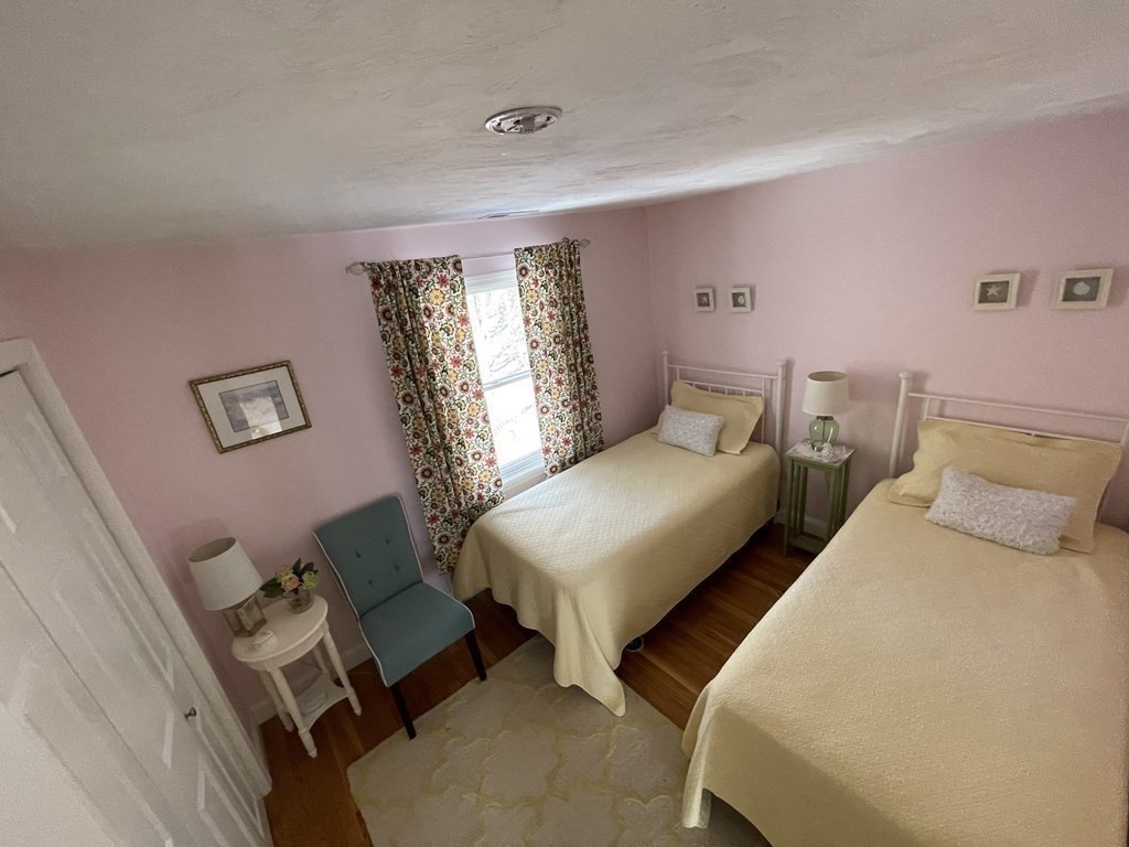 32 Birch Way Mashpee, MA 02649 - Photo 19 of 31 a bedroom with two beds and painted walls