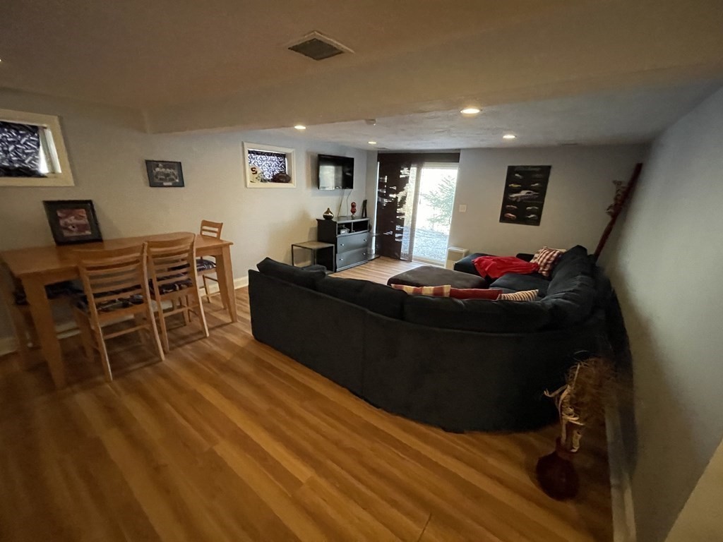 32 Birch Way Mashpee, MA 02649 - Photo 23 of 31 a living room with furniture and a wooden floor
