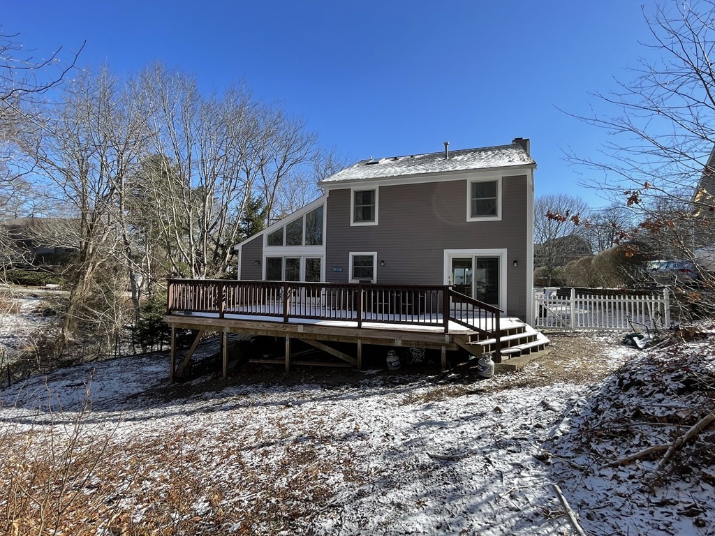 32 Birch Way Mashpee, MA 02649 - Photo 30 of 31 a view of a house with a yard and sitting area
