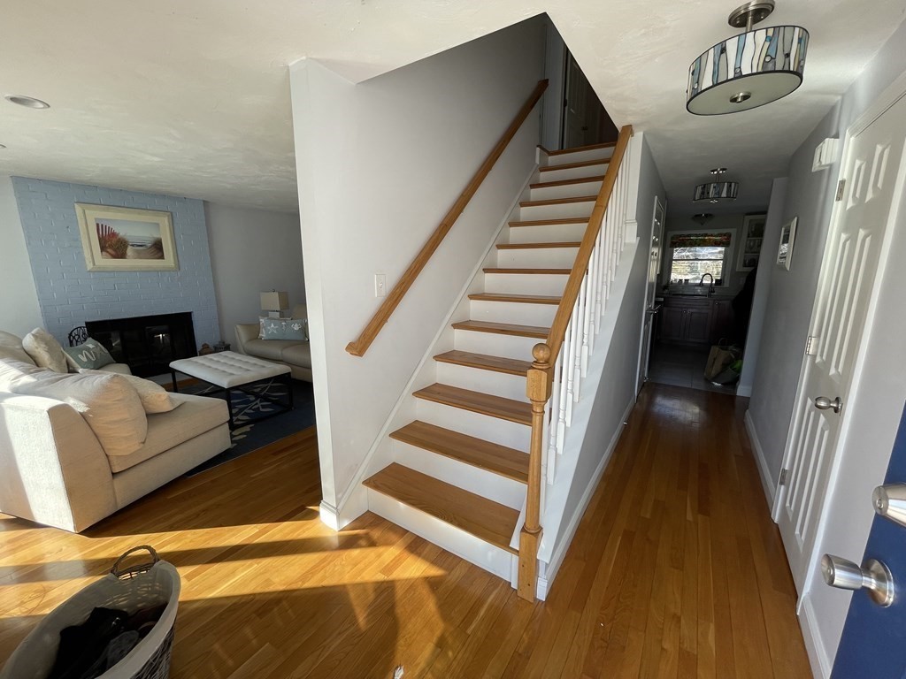 32 Birch Way Mashpee, MA 02649 - Photo 3 of 31 a view of a livingroom with furniture and staircase