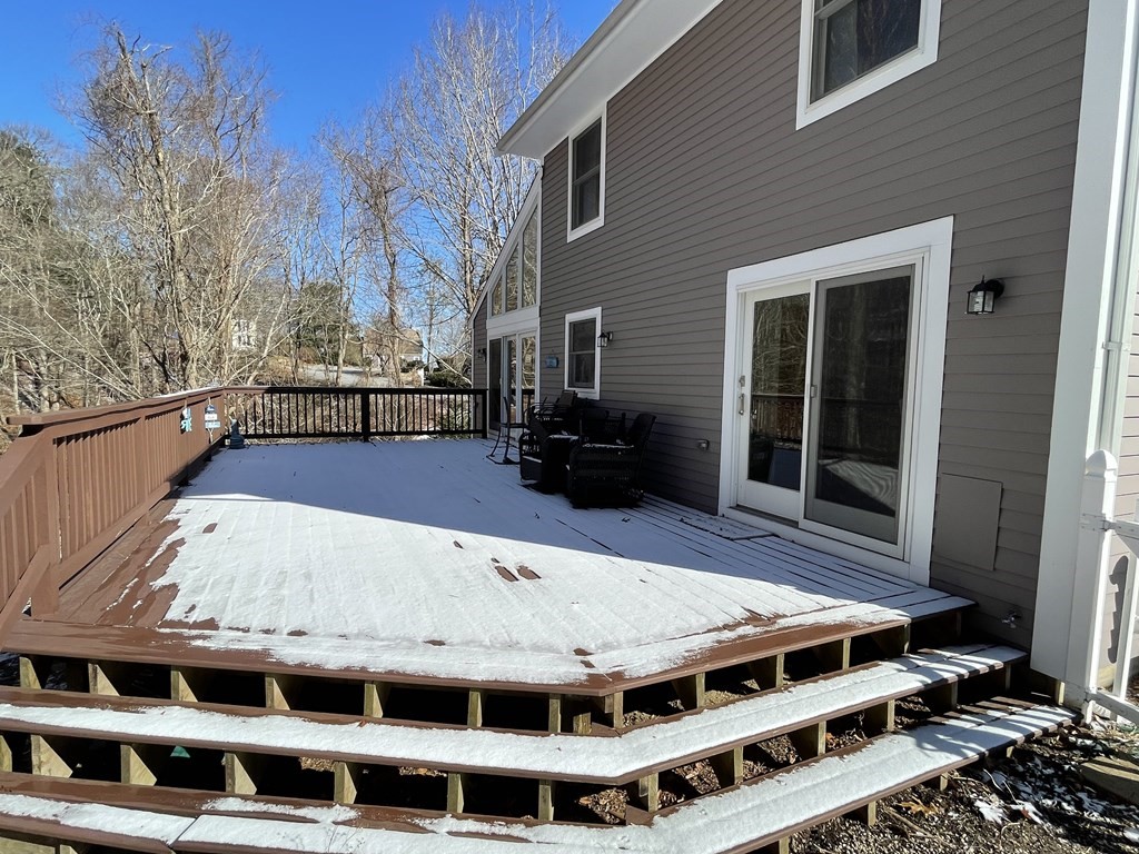 32 Birch Way Mashpee, MA 02649 - Photo 31 of 31 a view of a balcony with couches and wooden floor