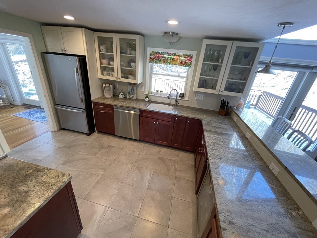 32 Birch Way Mashpee, MA 02649 - Photo 8 of 31 a kitchen with sink refrigerator and window