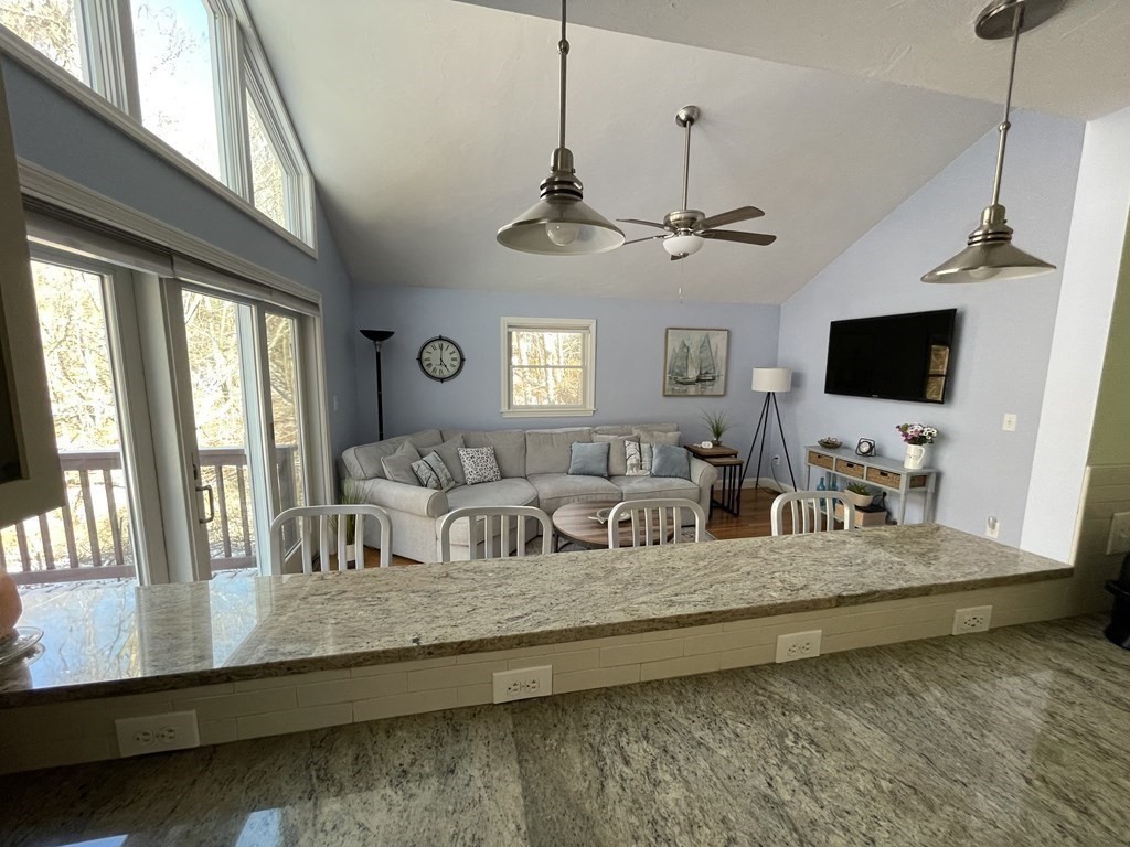 32 Birch Way Mashpee, MA 02649 - Photo 9 of 31 a view of living room with furniture flat screen tv and windows
