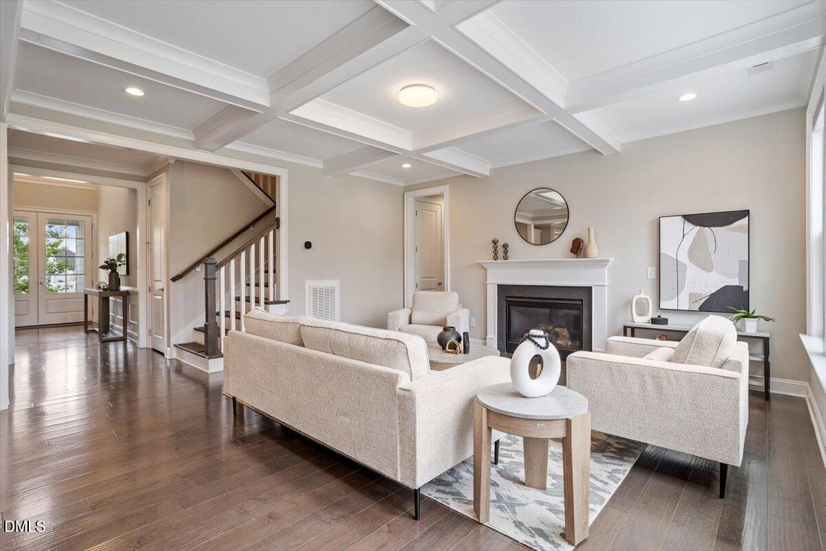 2844 Spring Shade Road Apex, NC 27523 - Photo 11 of 48 a living room with furniture a fireplace and a large window