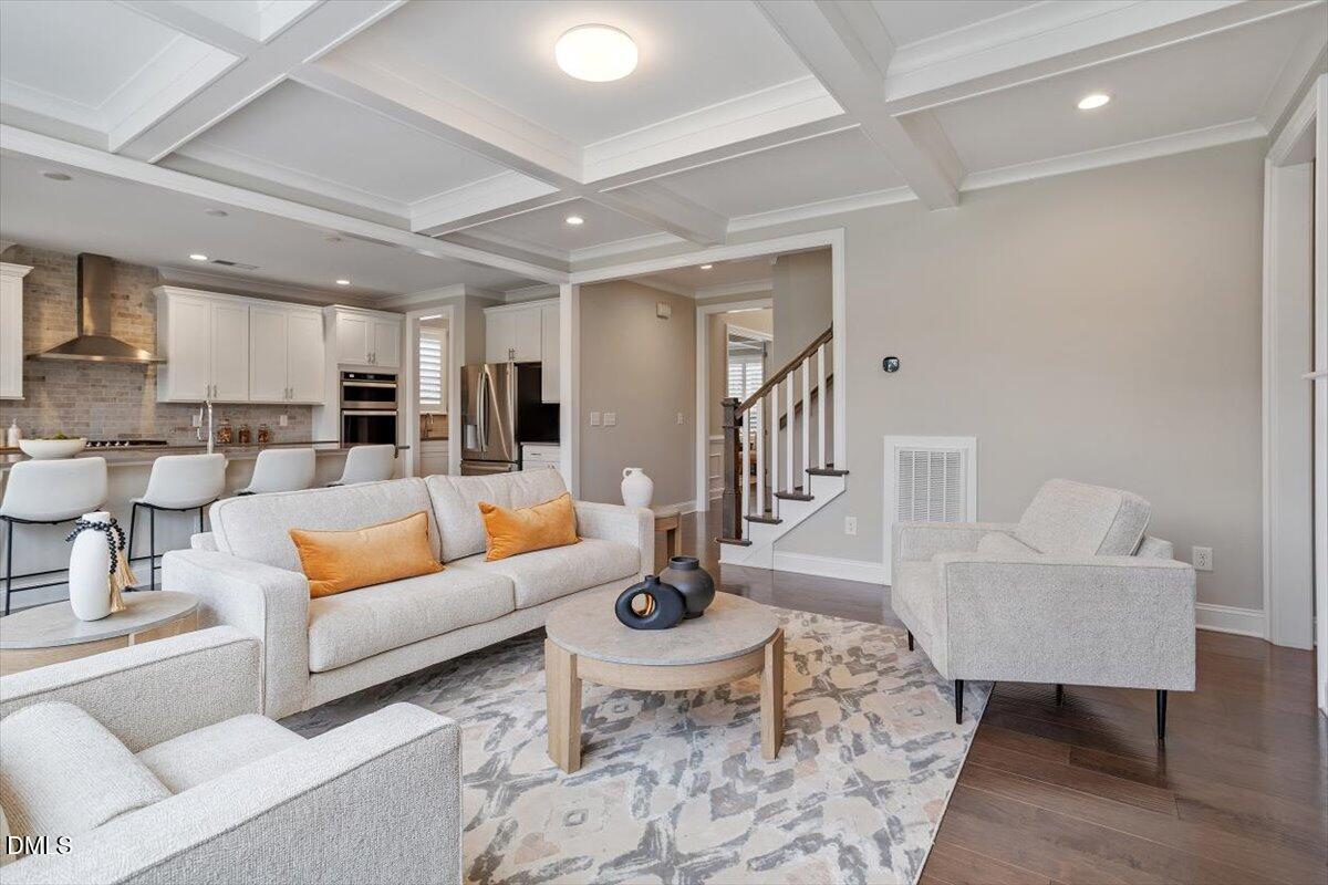 2844 Spring Shade Road Apex, NC 27523 - Photo 13 of 48 a living room with furniture and wooden floor