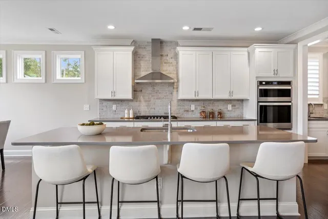a kitchen with a sink cabinets and window