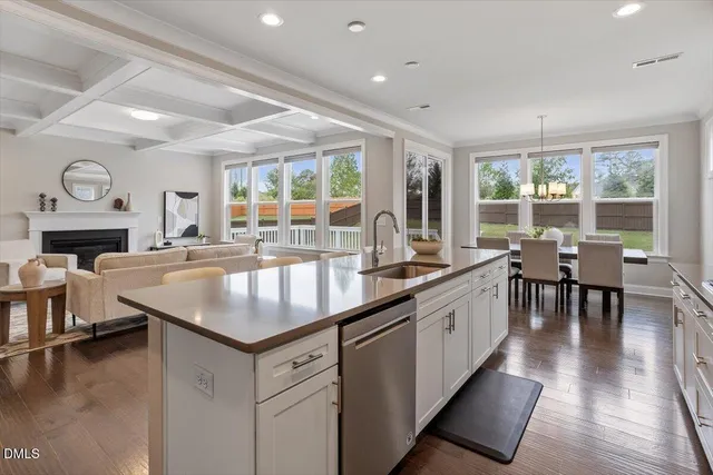 a kitchen with center island and a large window