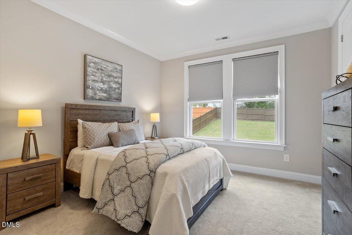 2844 Spring Shade Road Apex, NC 27523 - Photo 22 of 48 a bedroom with a bed and a window