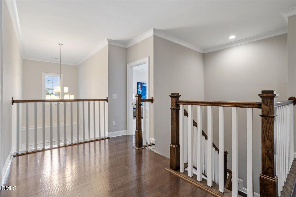 2844 Spring Shade Road Apex, NC 27523 - Photo 24 of 48 a view of a hallway with wooden floor