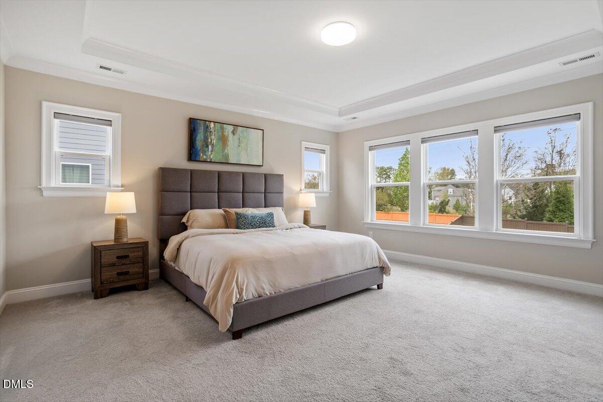 2844 Spring Shade Road Apex, NC 27523 - Photo 25 of 48 a large bed sitting in a bedroom next to a window