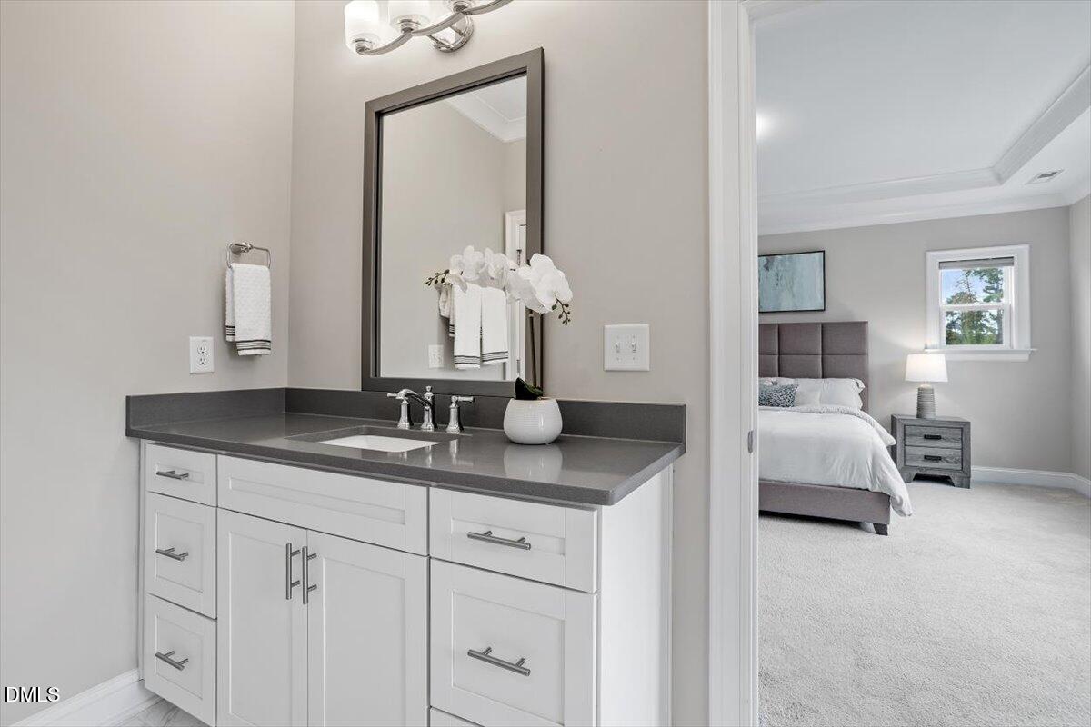 2844 Spring Shade Road Apex, NC 27523 - Photo 30 of 48 a en suite bathroom with sinks granite and mirror