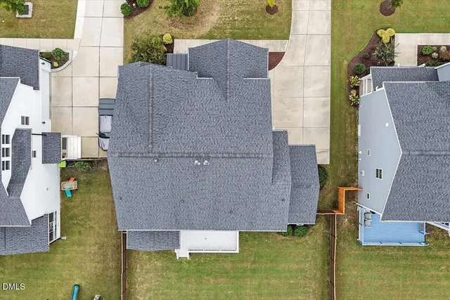 an aerial view of a house with a swimming pool
