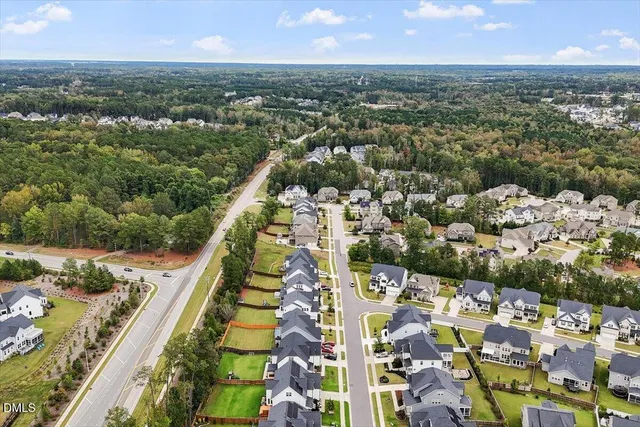 an aerial view of residential building and car parked