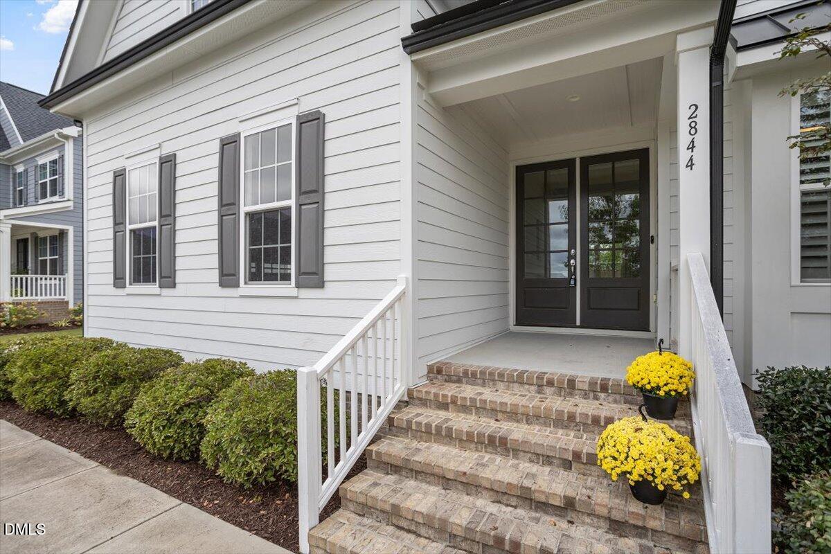2844 Spring Shade Road Apex, NC 27523 - Photo 5 of 48 a front view of a house with a garden