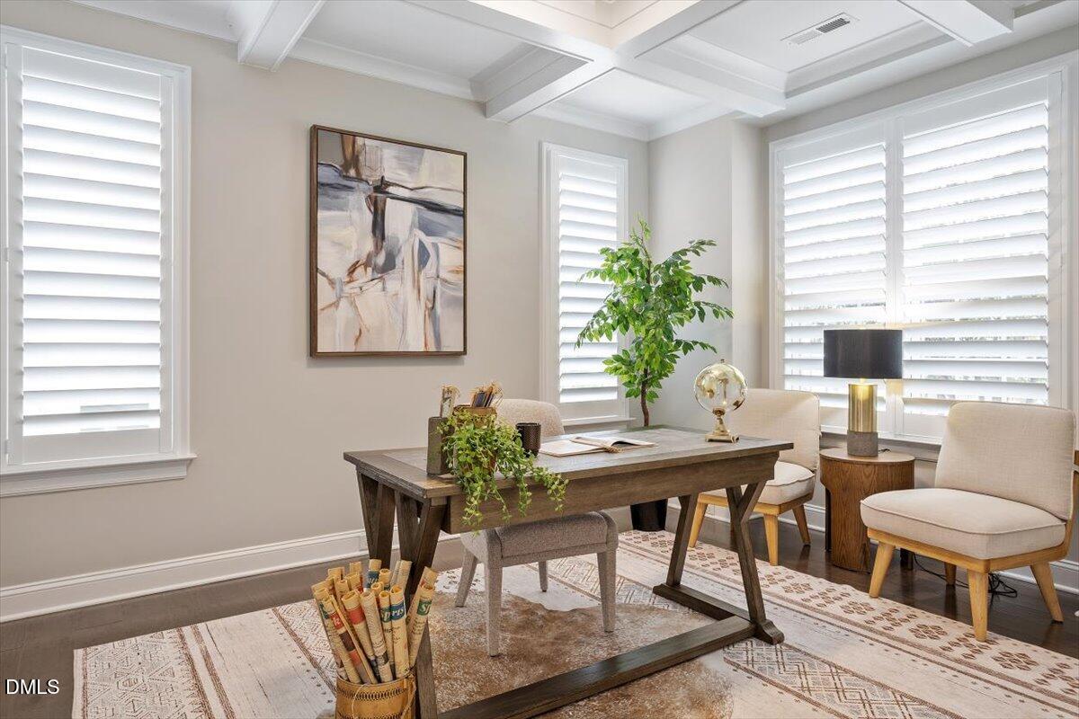 2844 Spring Shade Road Apex, NC 27523 - Photo 7 of 48 a workspace with furniture and a potted plant
