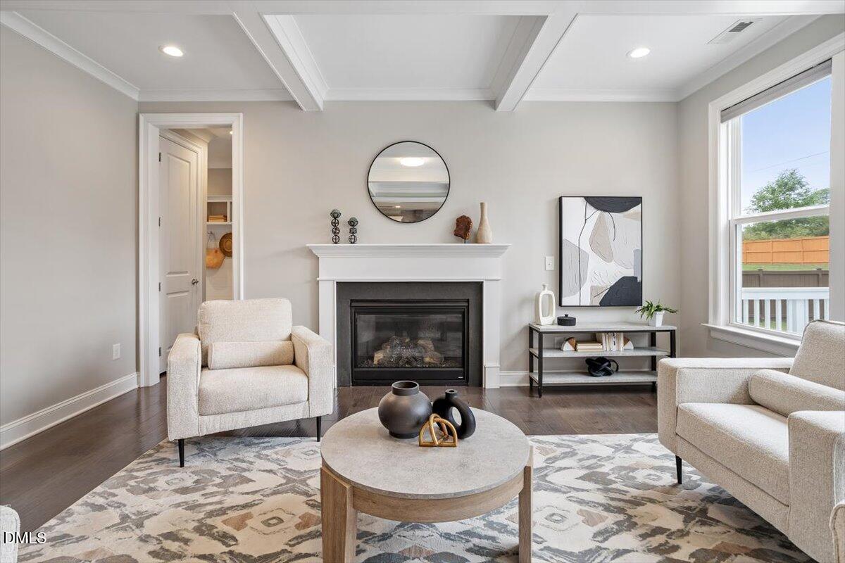 2844 Spring Shade Road Apex, NC 27523 - Photo 10 of 48 a living room with furniture and a fireplace