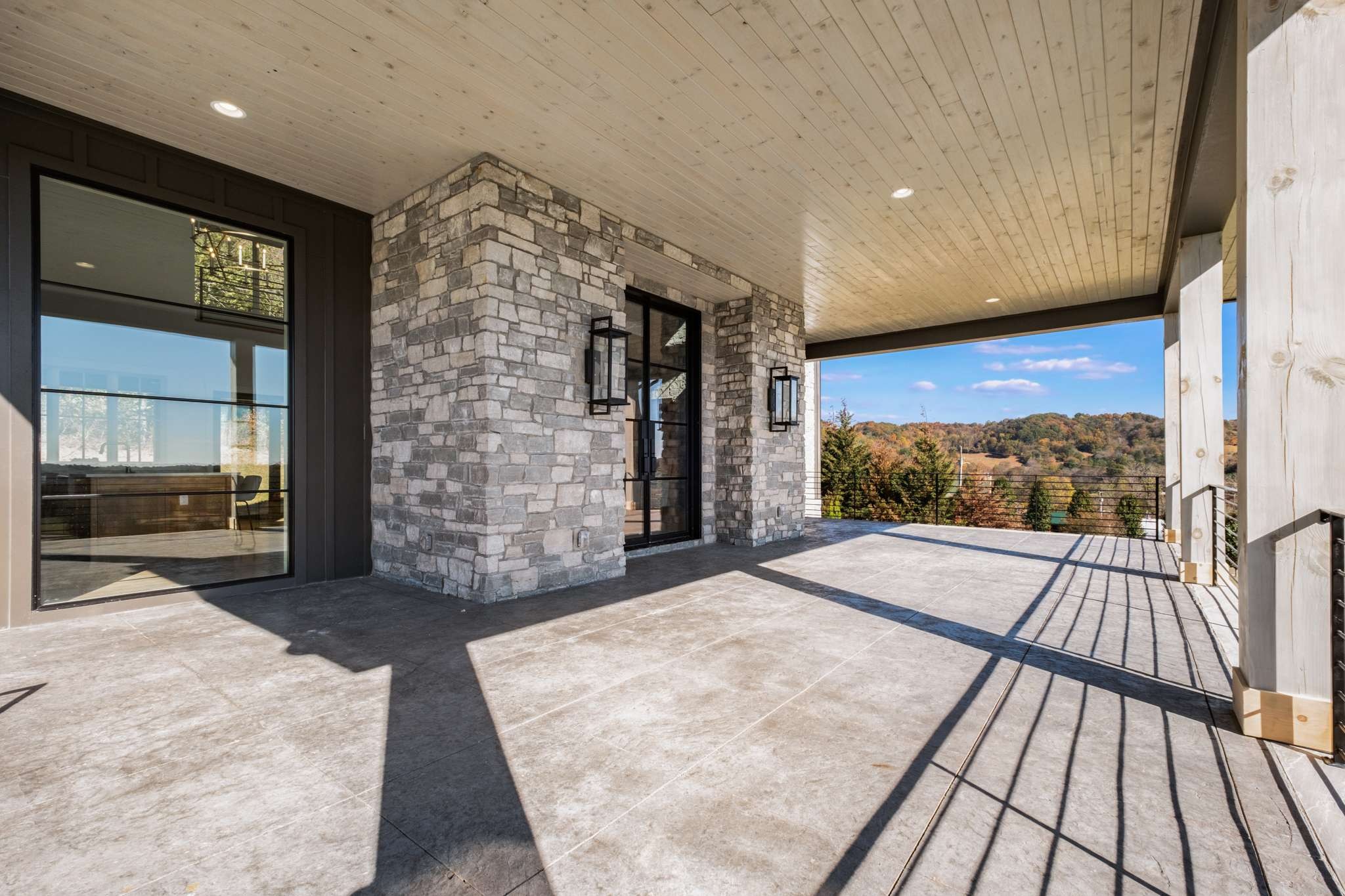 4660 Reed Road Thompson's Station, TN 37179 - Photo 4 of 69 a view of balcony with floor to ceiling windows