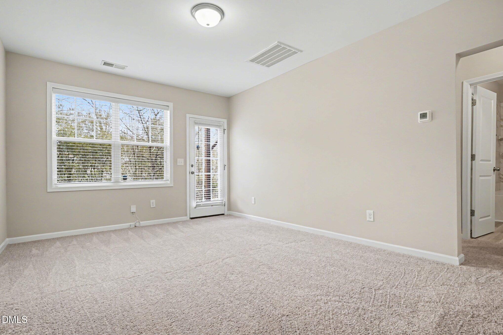 4245 Lofty Ridge Place Morrisville, NC 27560 - Photo 11 of 31 an empty room with windows