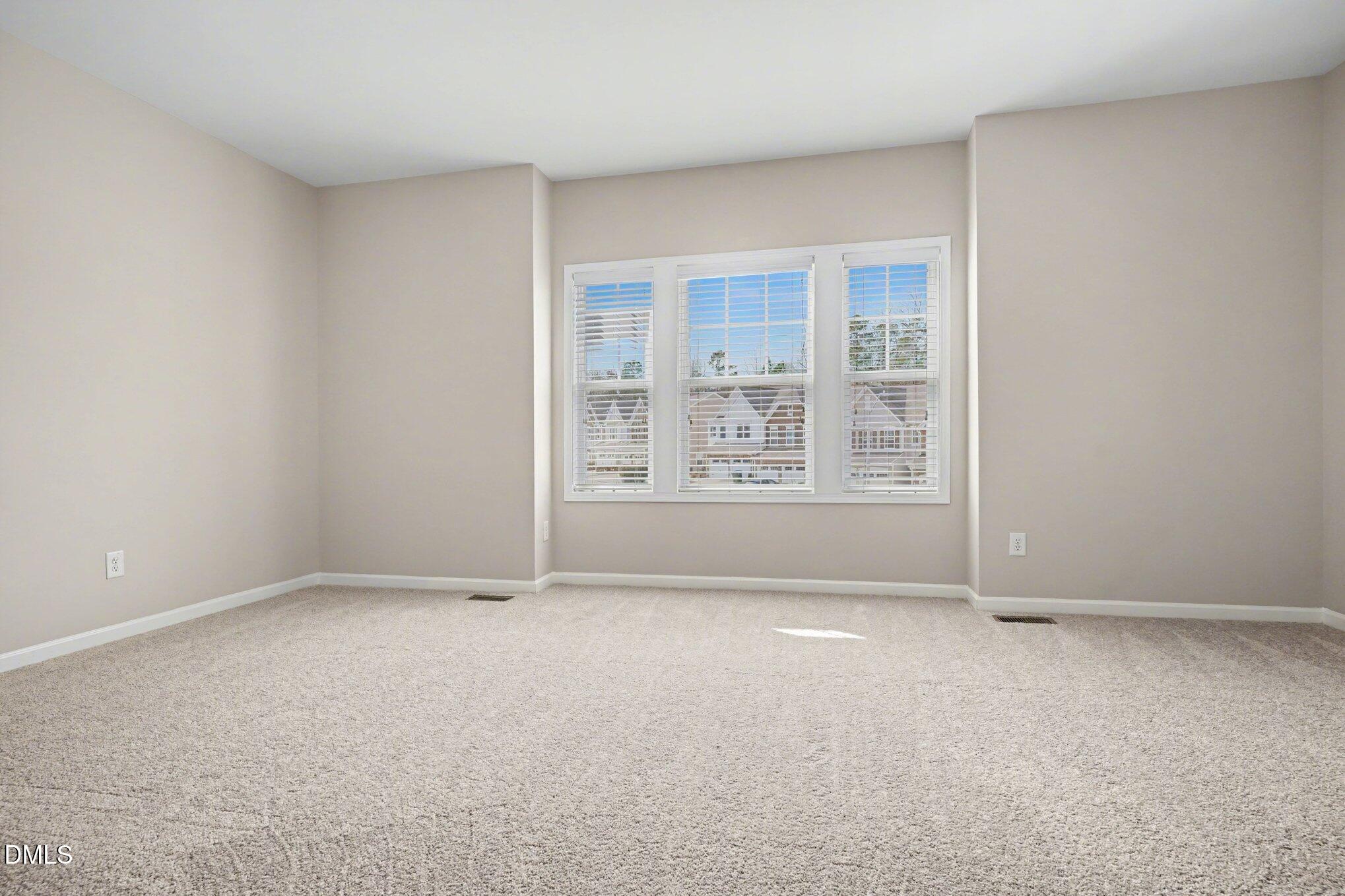 4245 Lofty Ridge Place Morrisville, NC 27560 - Photo 17 of 31 an empty room with windows