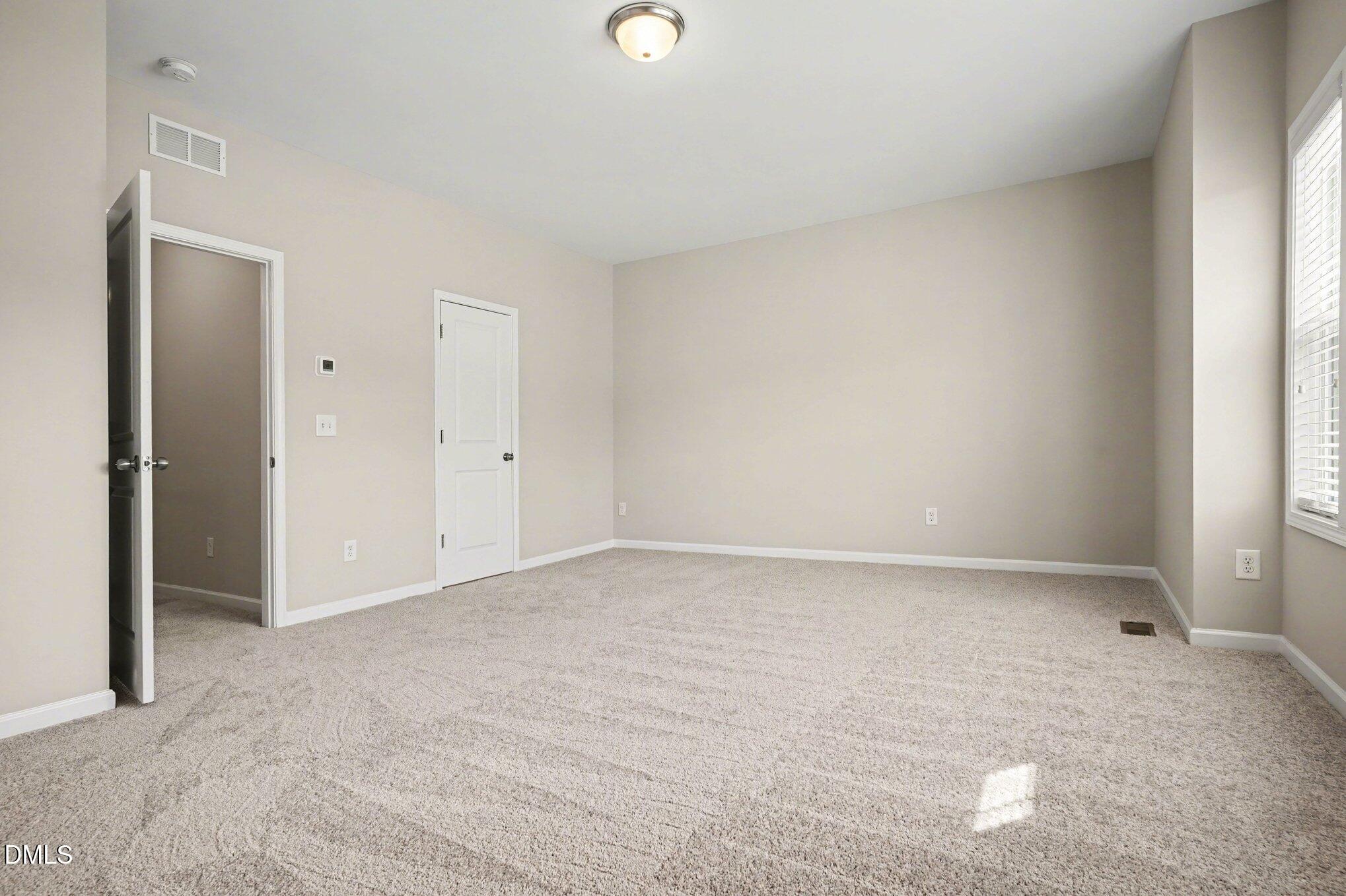 4245 Lofty Ridge Place Morrisville, NC 27560 - Photo 18 of 31 a view of an empty room and window