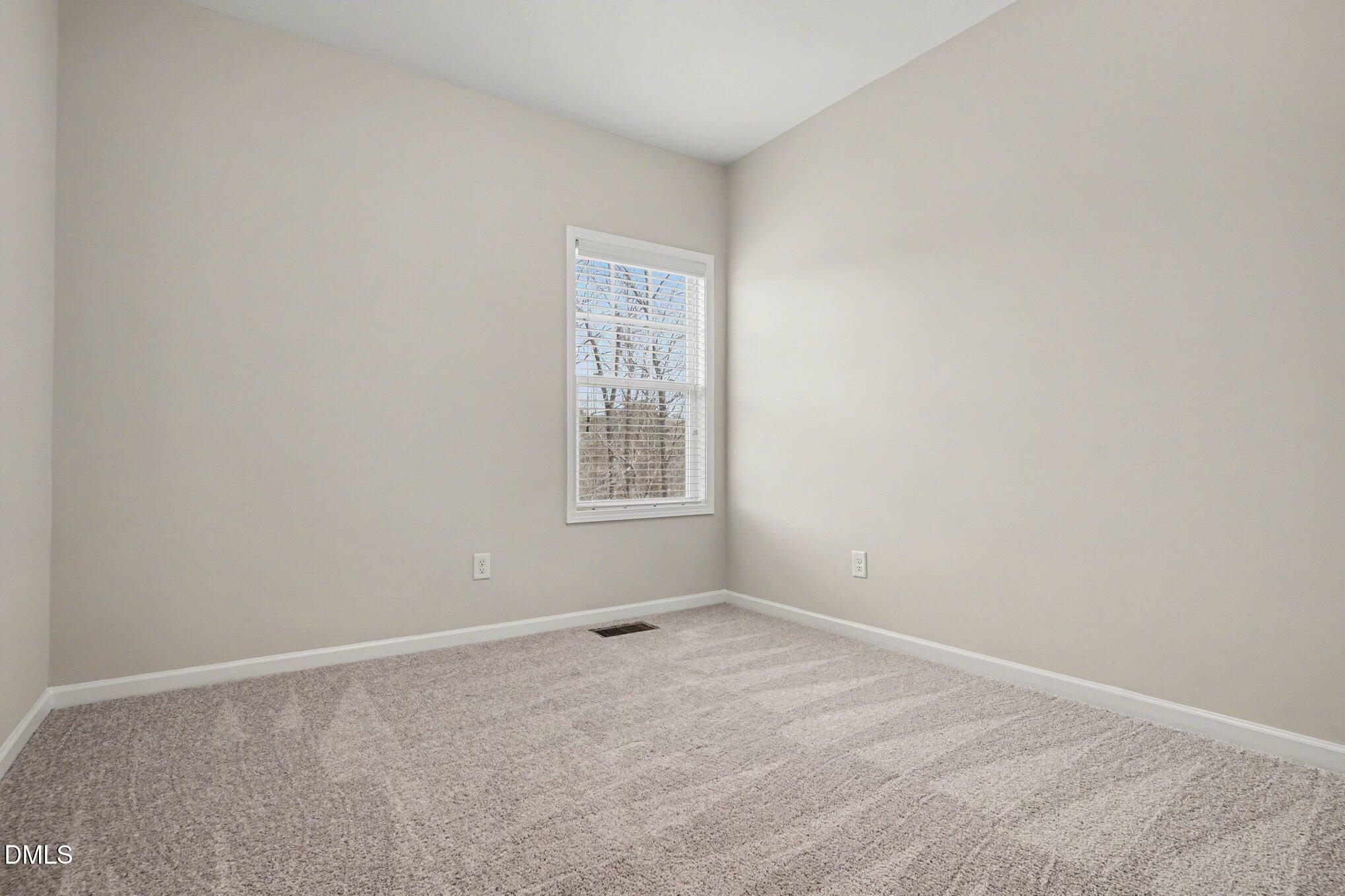 4245 Lofty Ridge Place Morrisville, NC 27560 - Photo 24 of 31 an empty room with windows