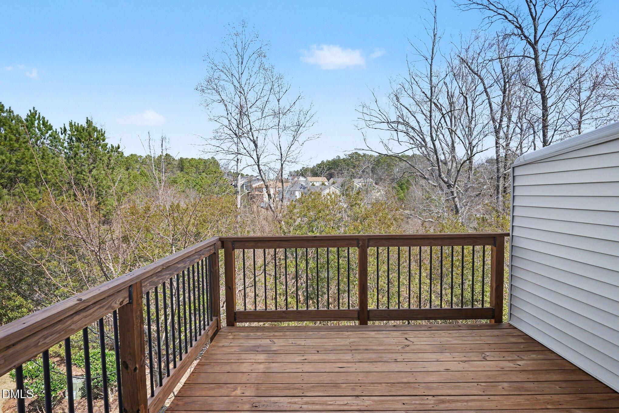 4245 Lofty Ridge Place Morrisville, NC 27560 - Photo 26 of 31 a balcony with wooden floor and fence