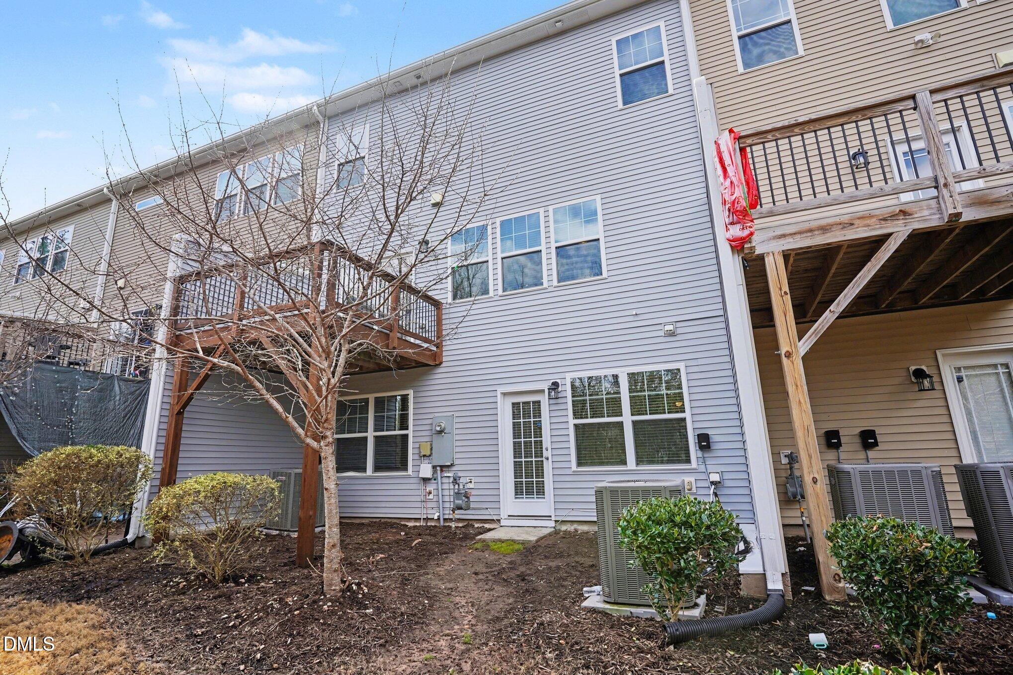 4245 Lofty Ridge Place Morrisville, NC 27560 - Photo 28 of 31 a front view of a house with garden