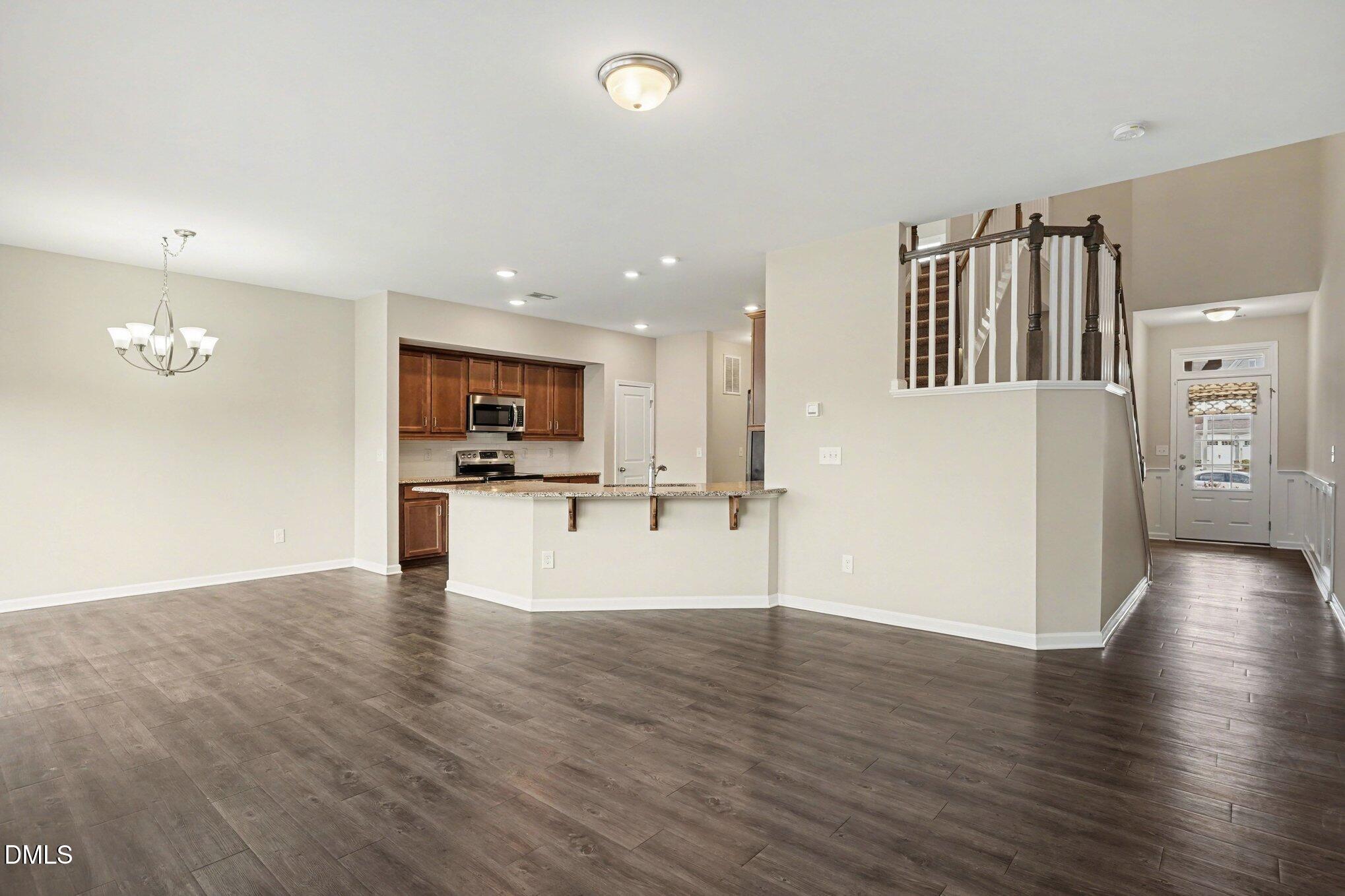 4245 Lofty Ridge Place Morrisville, NC 27560 - Photo 4 of 31 a view of kitchen with cabinets and wooden floor