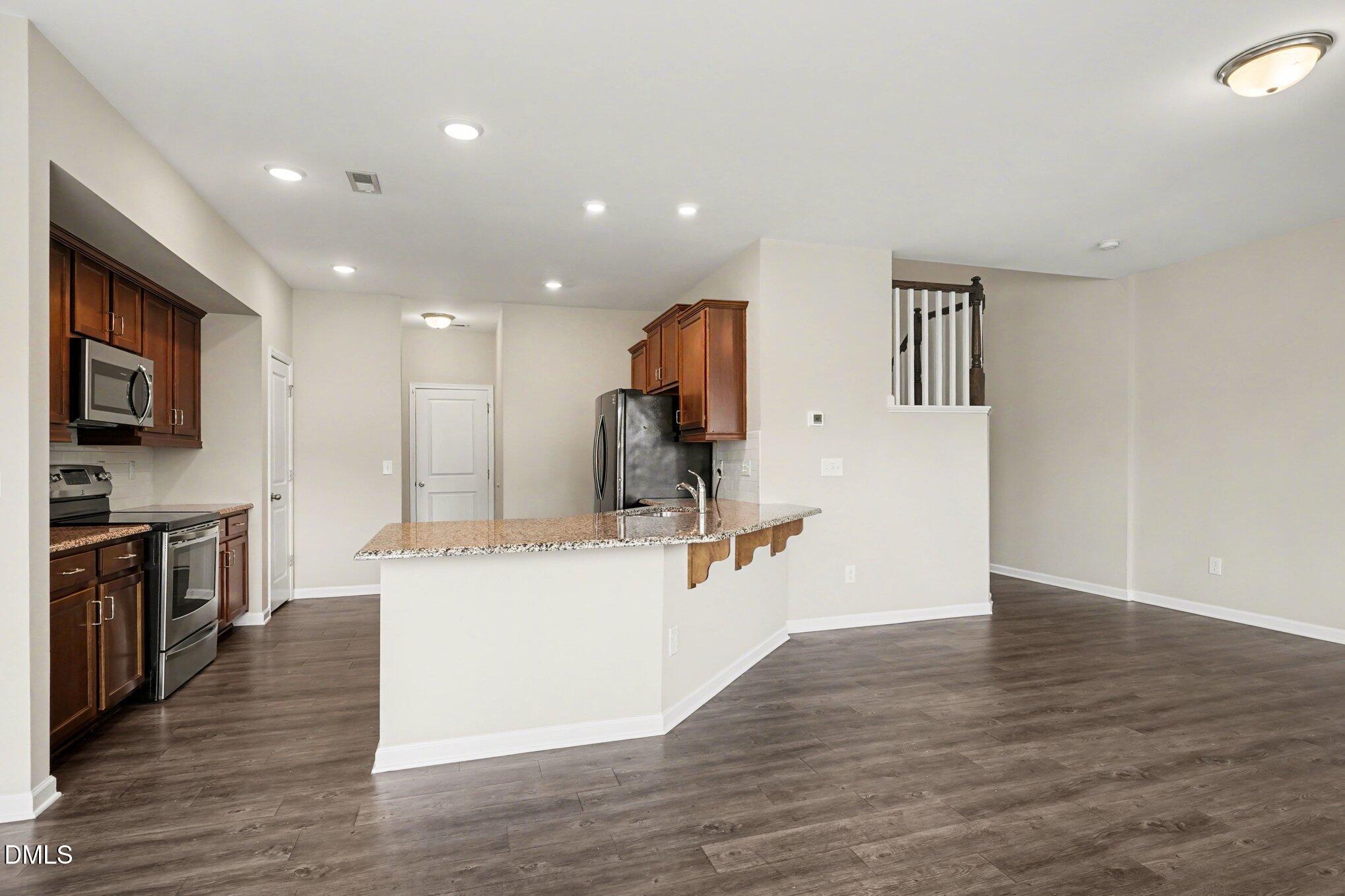 4245 Lofty Ridge Place Morrisville, NC 27560 - Photo 5 of 31 a view of kitchen with microwave and cabinets