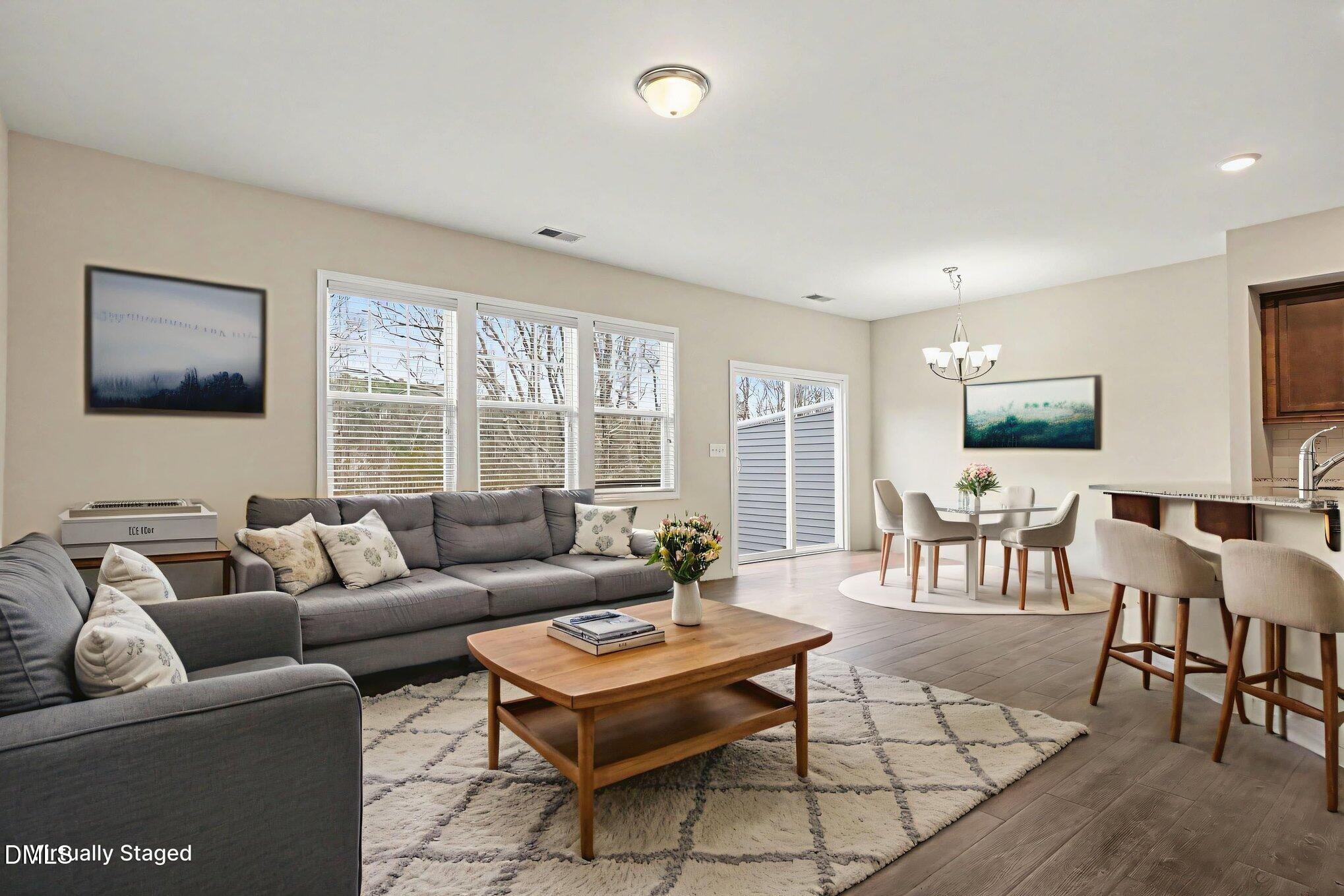 4245 Lofty Ridge Place Morrisville, NC 27560 - Photo 7 of 31 a living room with furniture and a large window