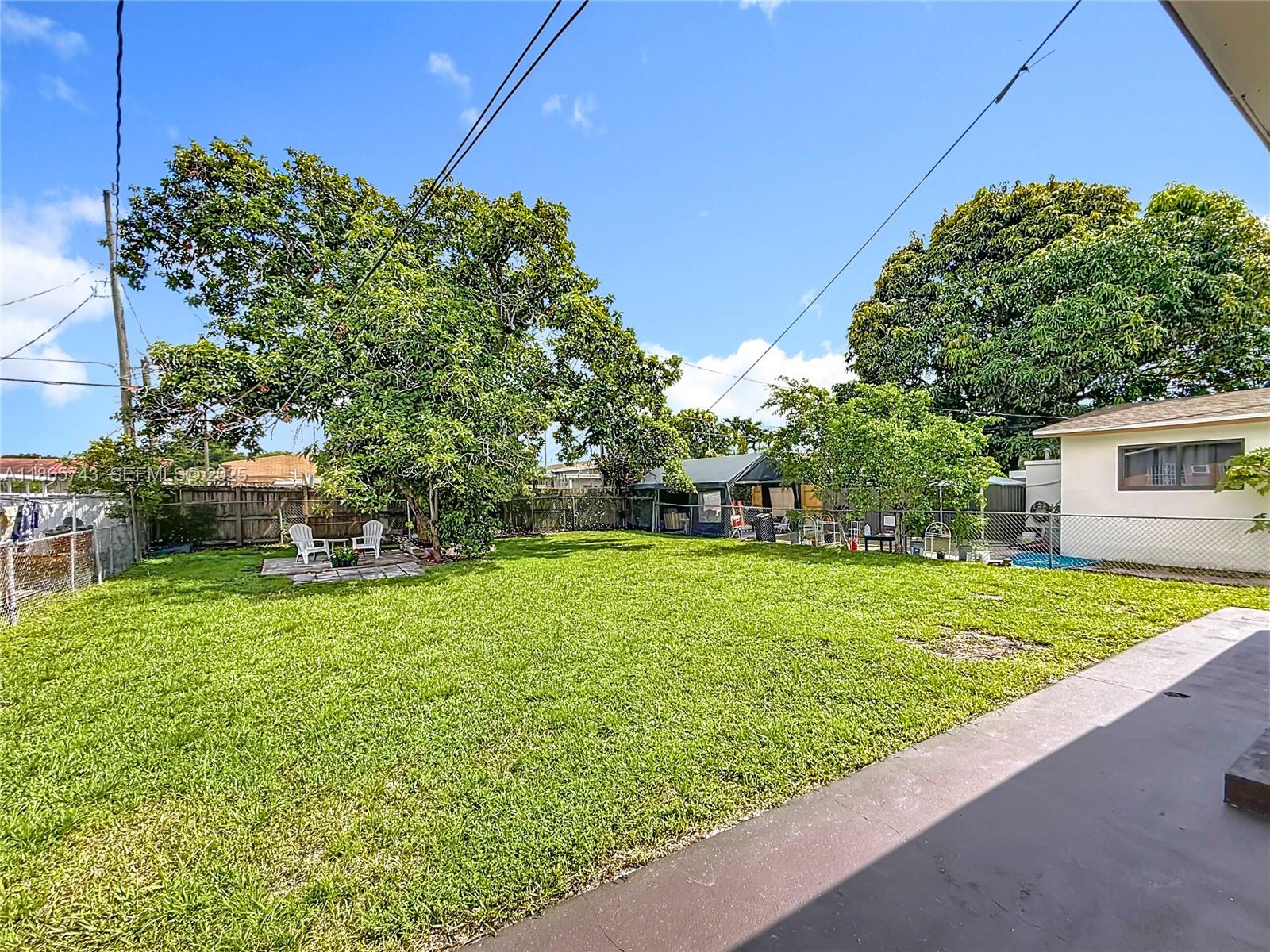 675 West 30th Street Hialeah, FL 33012 - Photo 14 of 17 a front view of a house with a yard
