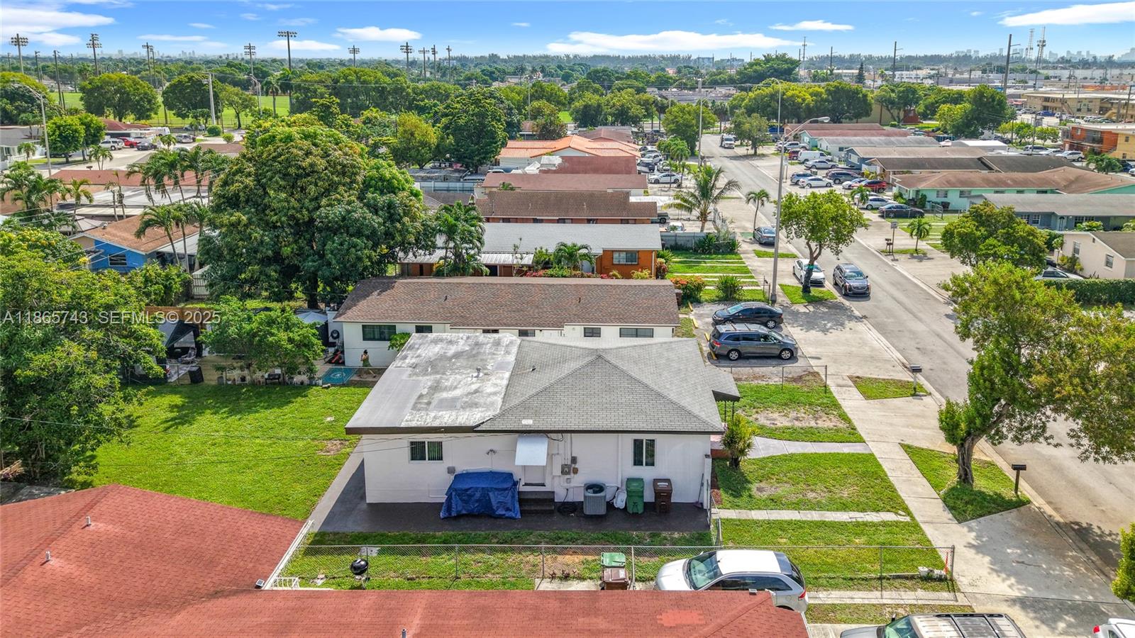 675 West 30th Street Hialeah, FL 33012 - Photo 16 of 17 an aerial view of a house with garden space pool seating area and yard