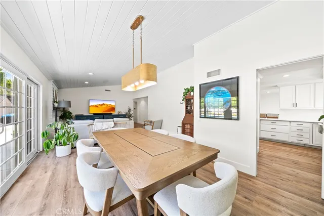 a large kitchen with a table and chairs in it