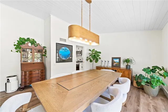 a kitchen with stainless steel appliances a refrigerator sink and cabinets