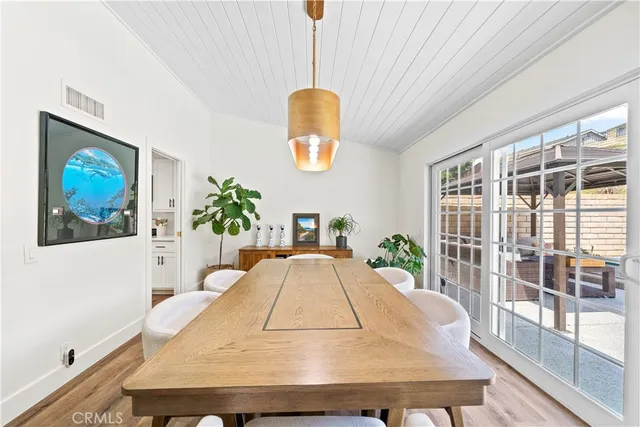 a kitchen with a refrigerator and a sink