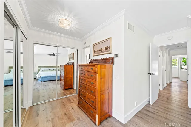 a bedroom with a bed dresser and a window