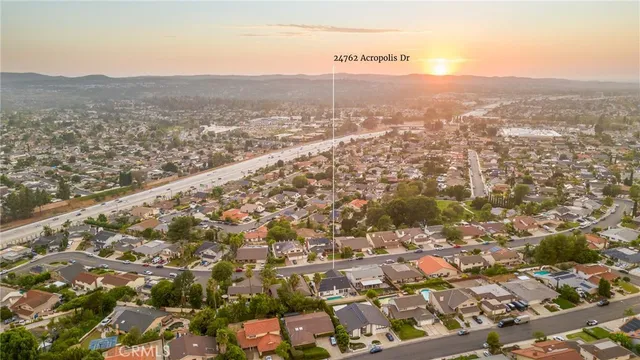 a view of a city with mountains in the background