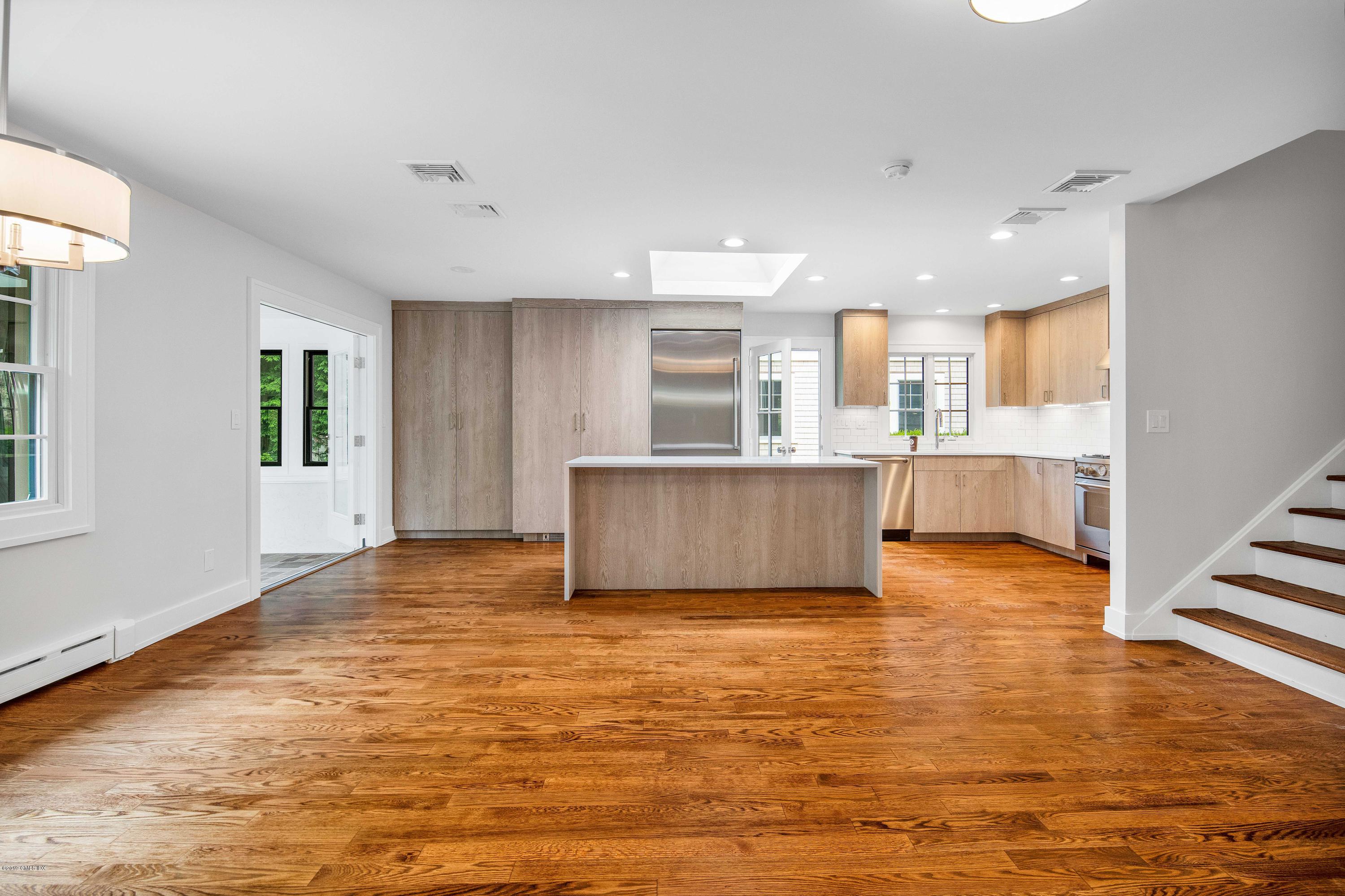 16 Sunshine Avenue Riverside, CT 06878 - Photo 3 of 9 a view of a kitchen with kitchen island wooden floors and stainless steel appliances