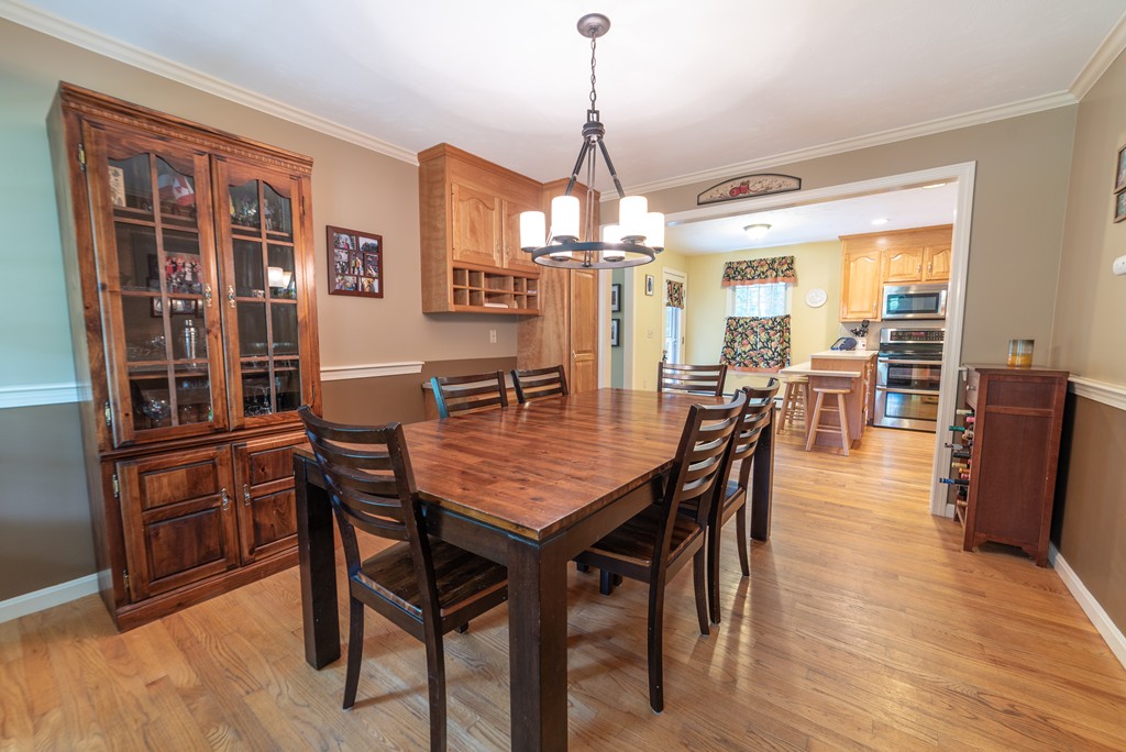 1565 West Street Wrentham, MA 02093 - Photo 12 of 30 a dining room with furniture window and wooden floor