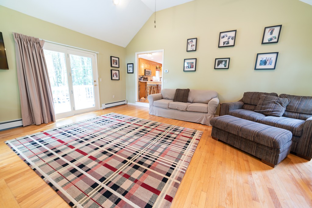 1565 West Street Wrentham, MA 02093 - Photo 14 of 30 a living room with a couch and a rug