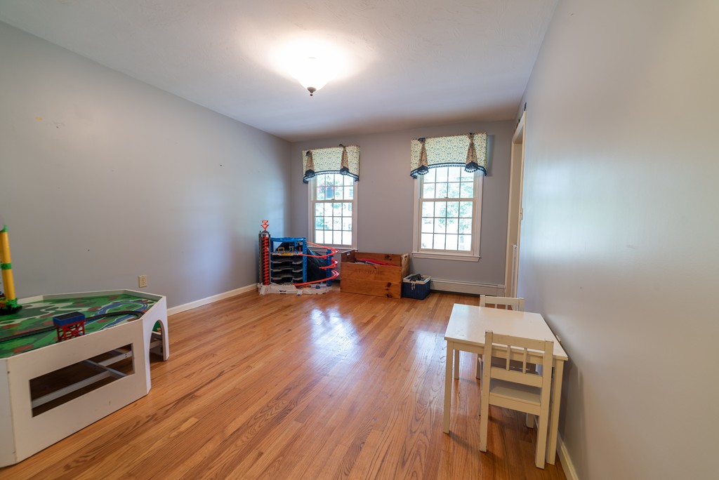 1565 West Street Wrentham, MA 02093 - Photo 17 of 30 a room with furniture and a wooden floor