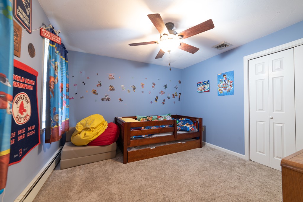 1565 West Street Wrentham, MA 02093 - Photo 20 of 30 a living room with furniture and a flat screen tv