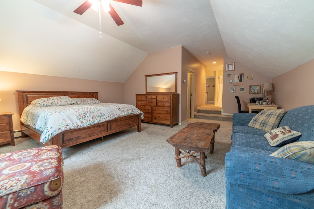 1565 West Street Wrentham, MA 02093 - Photo 25 of 30 a bedroom with a bed and furniture