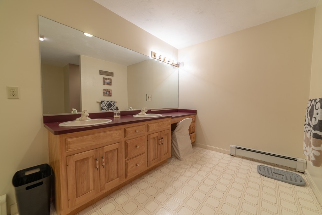 1565 West Street Wrentham, MA 02093 - Photo 27 of 30 a bathroom with a sink and a mirror