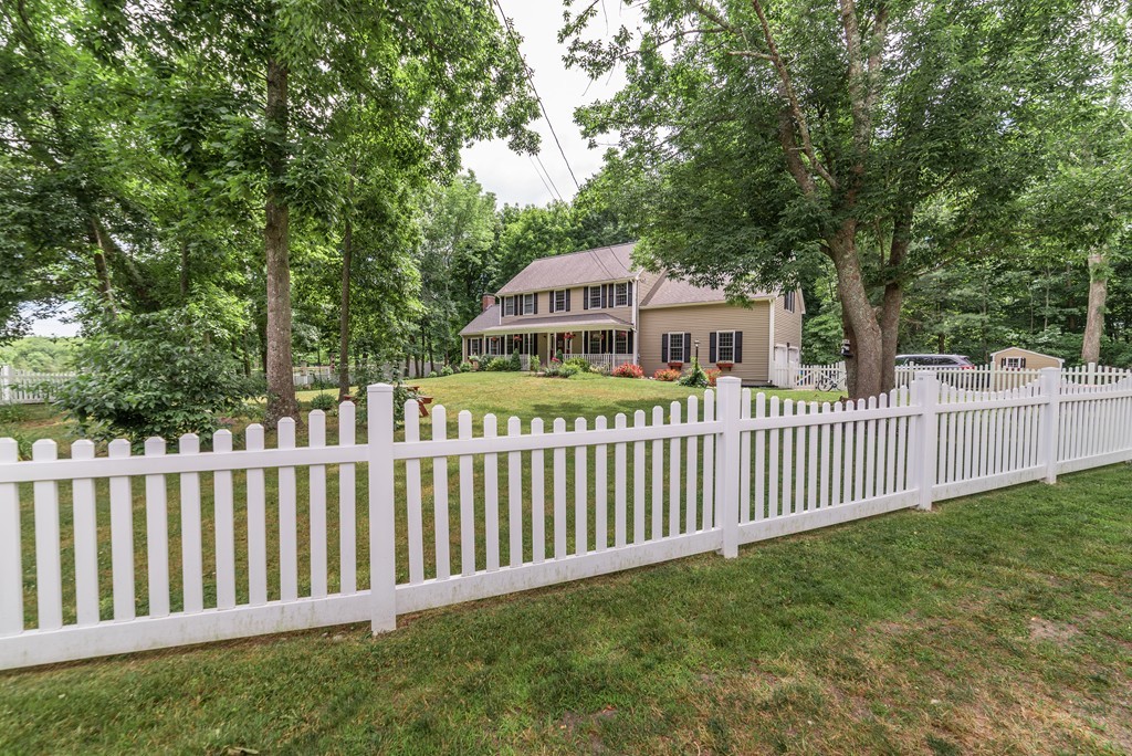 1565 West Street Wrentham, MA 02093 - Photo 30 of 30 a front view of a house having yard