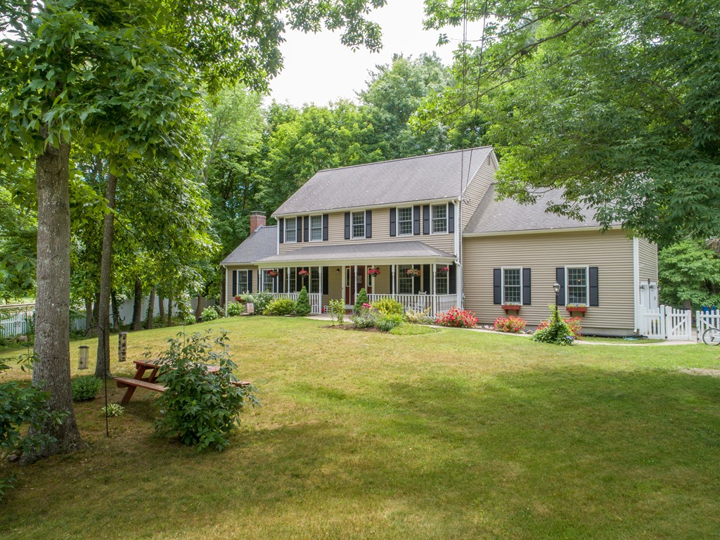 1565 West Street Wrentham, MA 02093 - Photo 4 of 30 a front view of a house with swimming pool having outdoor seating