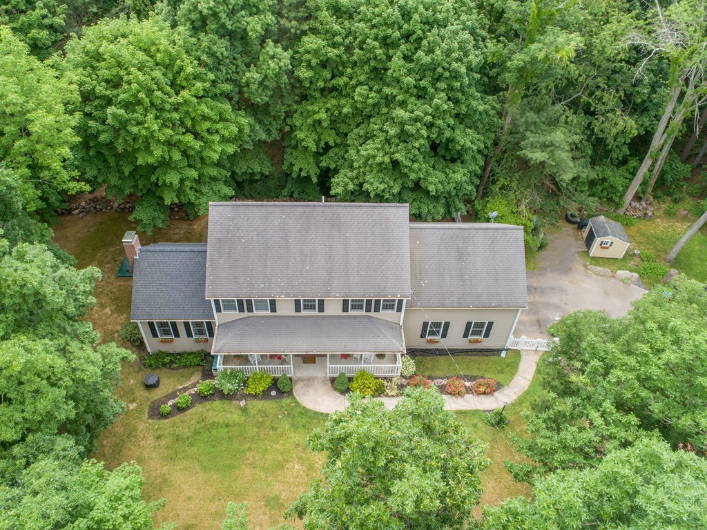 1565 West Street Wrentham, MA 02093 - Photo 5 of 30 an aerial view of a house with swimming pool and garden