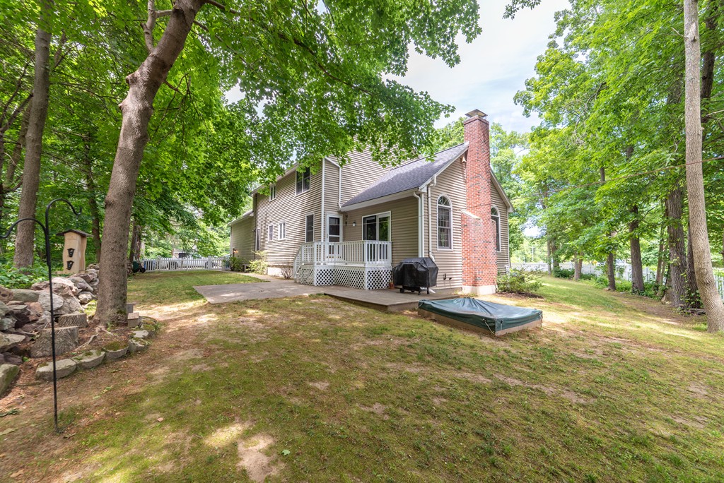 1565 West Street Wrentham, MA 02093 - Photo 6 of 30 a view of a house with backyard and trees